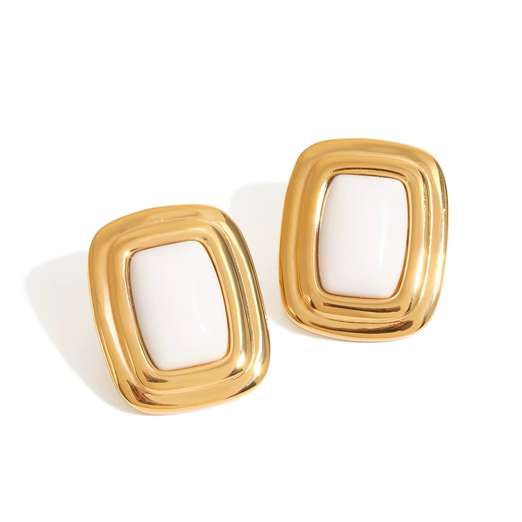 THÖKERCO Safiya gold-tone rectangular stud earrings with white centre on white background